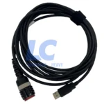 Technician using VOCOM II 88894000 for ECU programming and component calibration on a heavy-duty bus.